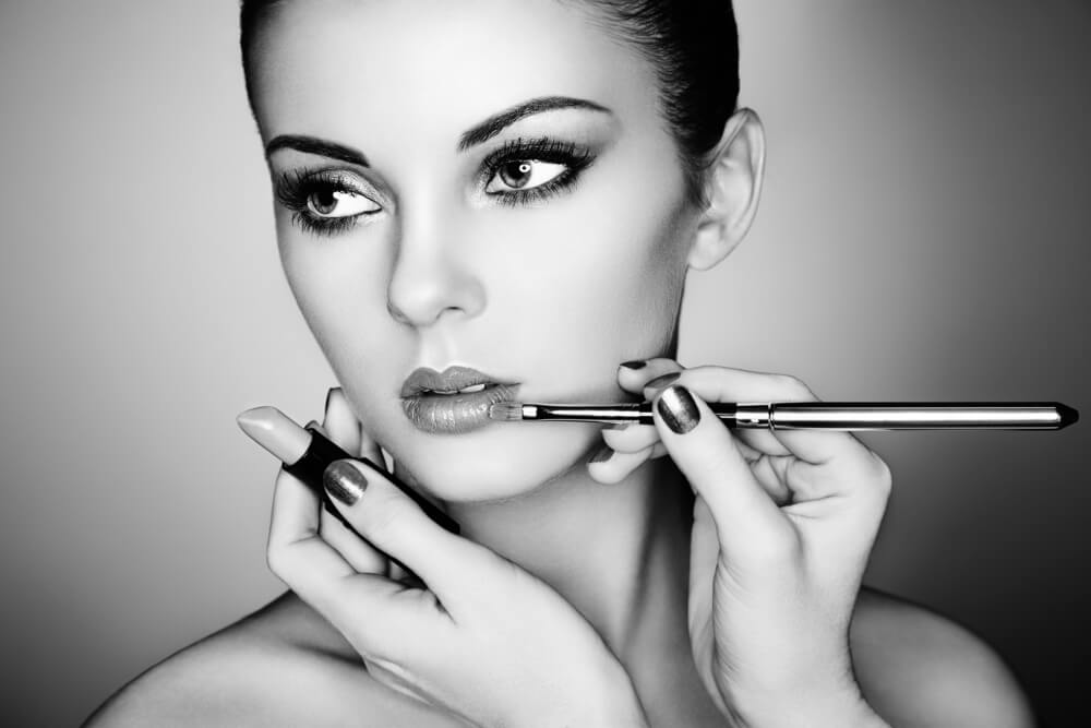 applying-makeup-on-beautiful-girl-black-and-white